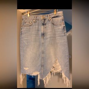 Gently worn denim distressed skirt with raw asymmetrical hem